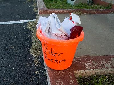 Clean rags, Meguiar's Spray and Wipe and Windex, plus a hose nearby if you want to do the job well.